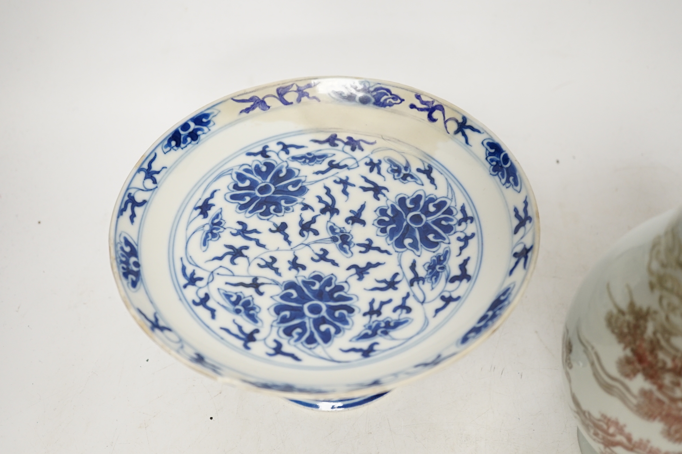 A Chinese underglaze copper red ‘herder and goats’ vase, Kangxi six character mark but Republic period and a Chinese blue and white lotus stem dish, six character Guangxu mark and period, both damaged
